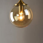 Glass Torch Wall Light in Brass | Knesse